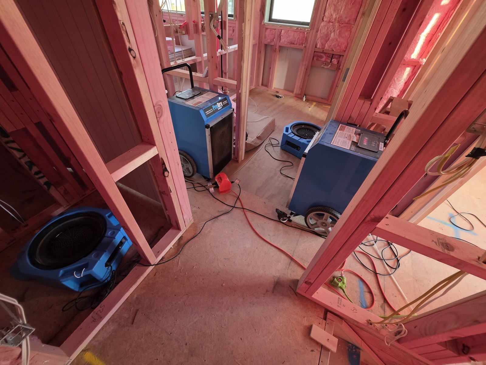 ProDry dehumidifier and air mover set up in a new-build hallway