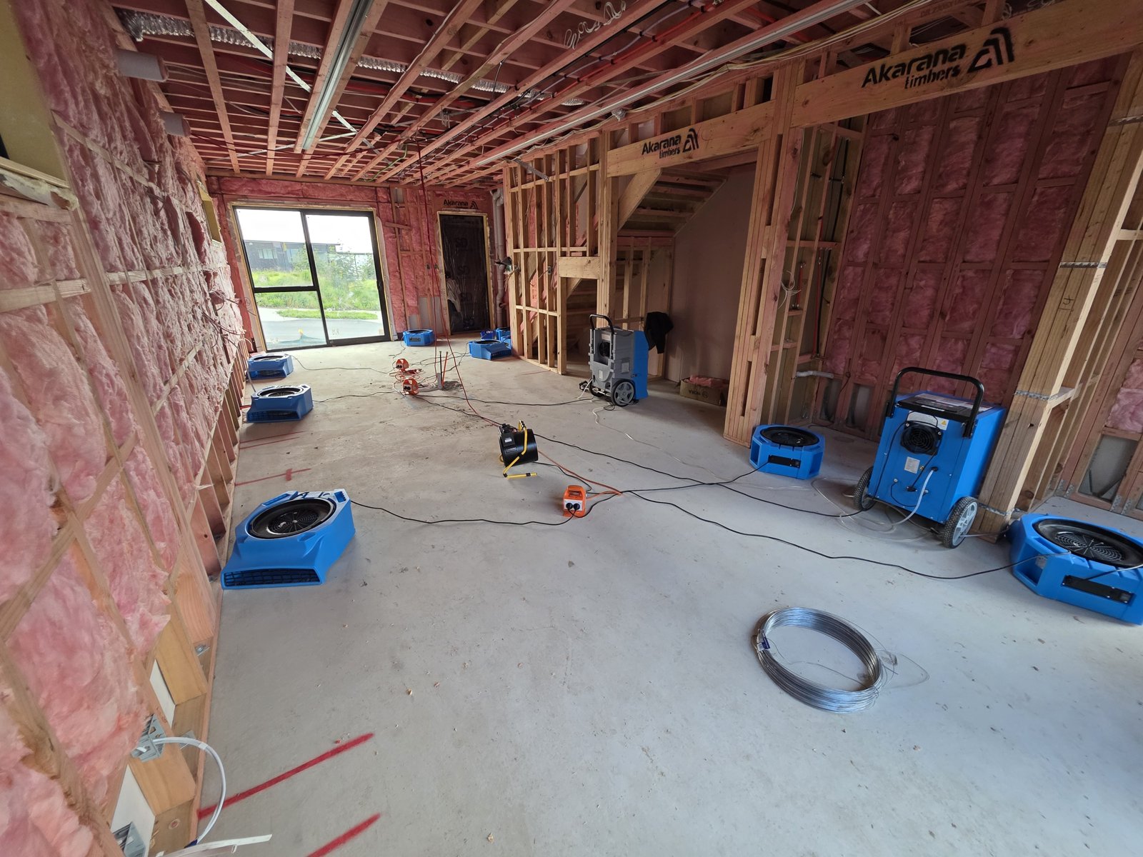 ProDry dehumidifier and air movers drying a large new-build frame interior